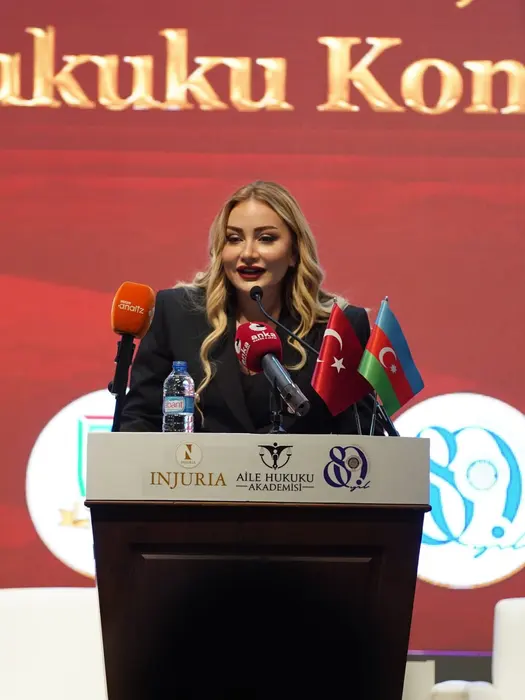 At the podium of the INJURIA and Family Law Academy conference