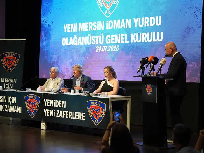 Yeni Mersin İdman Yurdu Extraordinary General Assembly — podium and press microphones
